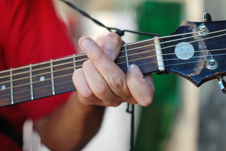 Musician playing old guitarの写真素材