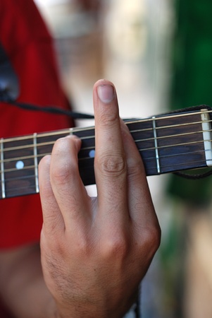 Musician playing old guitarの写真素材