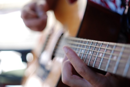 Musician playing old guitar