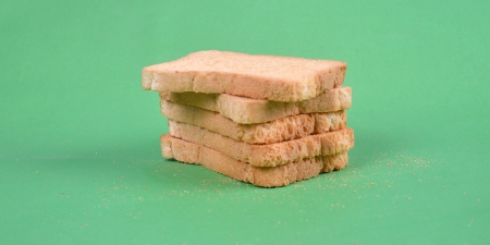 Toast bread on green background