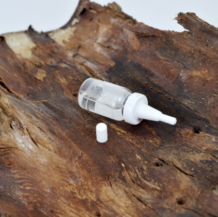medicine dropper on wooden back の写真素材