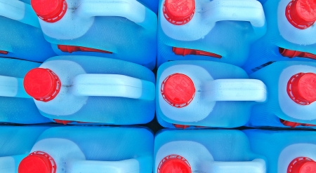 Bottles of blue transparent dish washing liquidの写真素材