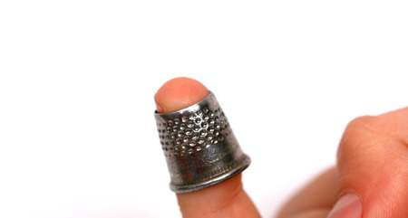Male Finger with a thimbleの写真素材
