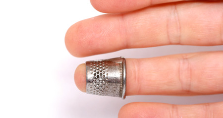 Male Finger with a thimble