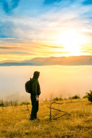 Backpacker on sunsetの写真素材
