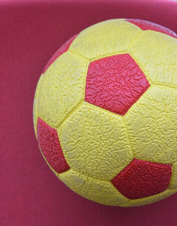 Yellow red soccer ballの写真素材