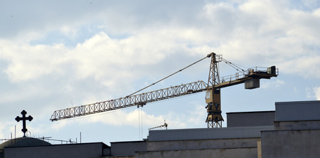 cross and crane in skopje, macedoniaの写真素材