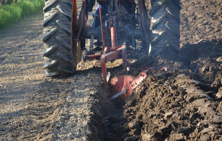 Agriculture ploughing tractor at workの写真素材