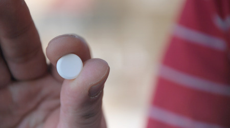 pill on a handの写真素材