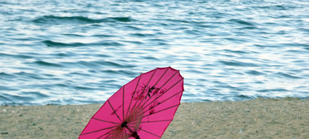 Japanesse umbrela on a beachの写真素材