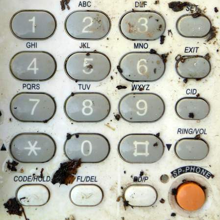 Dirty old phone keypadの写真素材