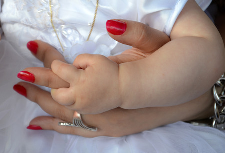baby hold mother handの写真素材