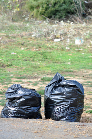 black garbage full of garbage の写真素材