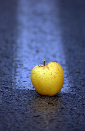 yellow apple middle of the roadの写真素材