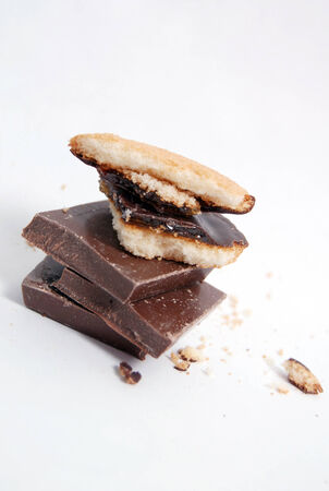 Chocolate pieces and  cake with orange fillの写真素材