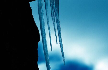 Icicles against  blue skyの写真素材