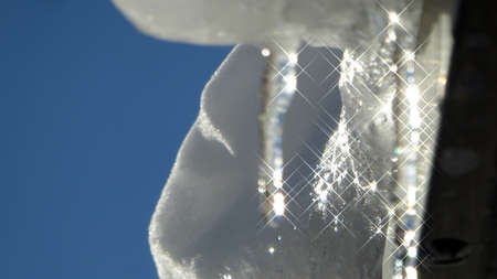 Icicles against  blue skyの写真素材