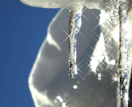 Icicles against  blue skyの写真素材