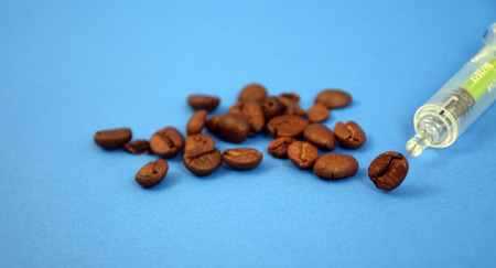 Coffee adiction, picture of a coffee beans and syringeの写真素材