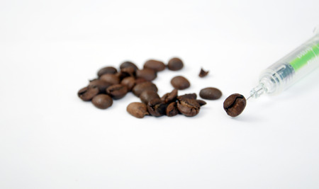Coffee adiction, picture of a coffee beans and syringeの写真素材