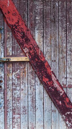 Picture of an  Old    wooden door with peeled paintの写真素材