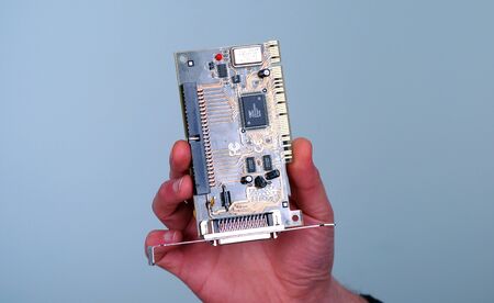 Picture of a male hand hold computer cardの写真素材