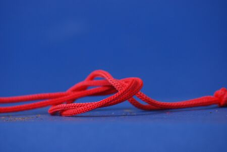 red rope with a knotの写真素材