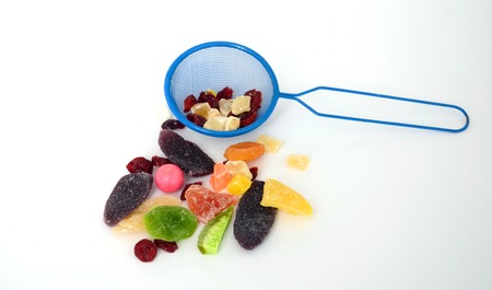 Some dried fruit mix  nad tea strainer ready to snack on
