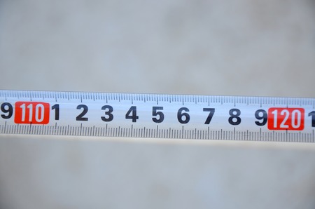 Picture of a White measure tape on blurred backgroundの写真素材