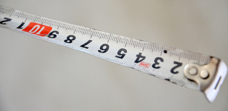 Picture of a White measure tape on blurred background