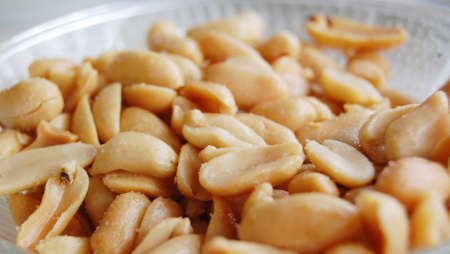 Picture of a fried peeled and salted peanuts.