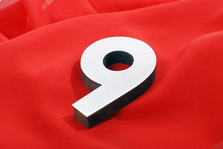 pictrure of a  number    9  on a red backgroundの写真素材
