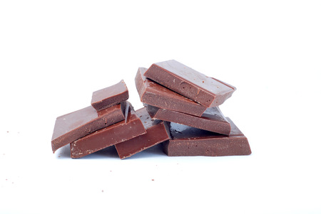 Picture of a broken chocolate pieces on white backgroundの写真素材