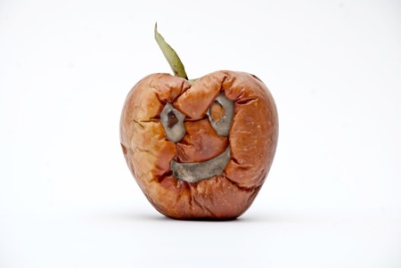 Picture of a Rotten apple , human face, aging conceptの写真素材