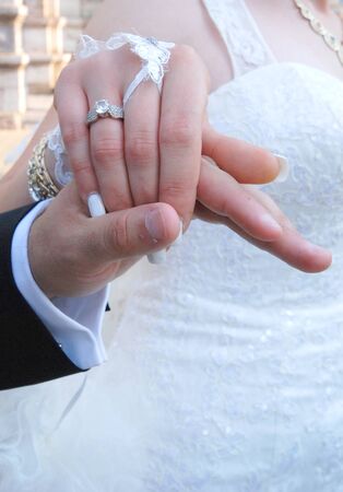 Picture of a Bride and groom holding his handsの写真素材