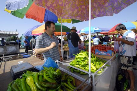 Resen, Macedonia - August 1, 2015: Fruit and vegetable sellers at the market.のeditorial素材
