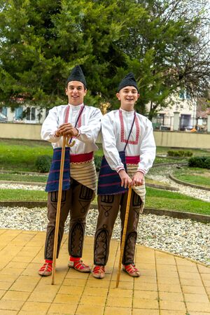 Members of folk group Tashe Miloshevski , posing in yard of a well known building Saray in Macedonia.Resen , Macedonia on november 25, 2013のeditorial素材
