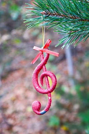 Picture of a christmas music note in an autumn forest