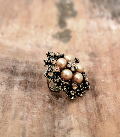picture of a Fashion ring on wood backgroundの写真素材