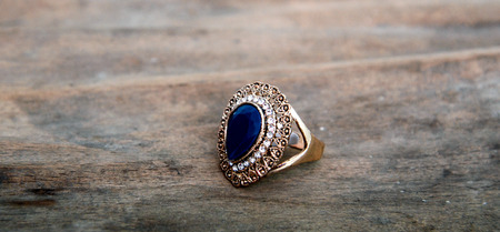 picture of a Fashion ring on wood backgroundの写真素材
