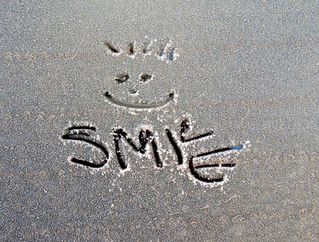 picture of a text smile  on frost car windowの写真素材