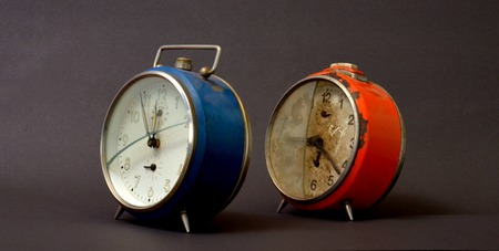 Picture of a vintage alarm clocks with broken glass