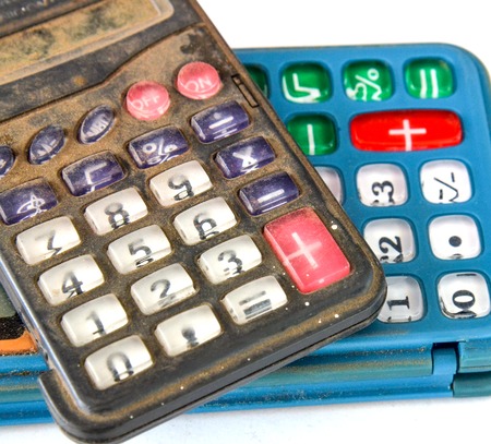 Picture of an Old dusty and dirty calculatorの写真素材