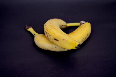 Picture of a ripe banana fruit on a dark backgroundの写真素材