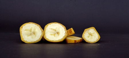 Picture of a ripe banana fruit on a dark background