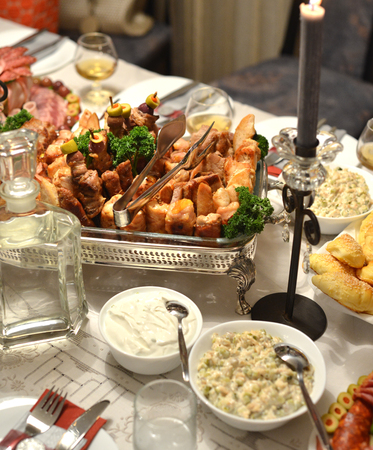 Picture of a Well decorated festive  table with foodの写真素材
