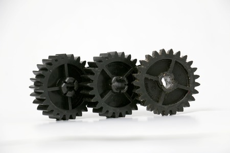 picture of a black old plastic dirty cogwheelの写真素材