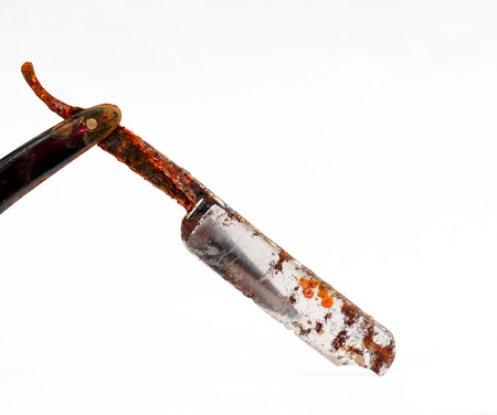 picture of an old rusty damaged razorの写真素材