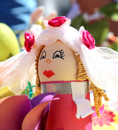 painted human face on easter eggの写真素材