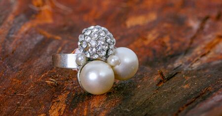 picture of a jewelry on wooden backgroundの写真素材